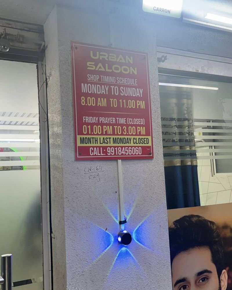 Urban Saloon shop timing board at the salon entrance