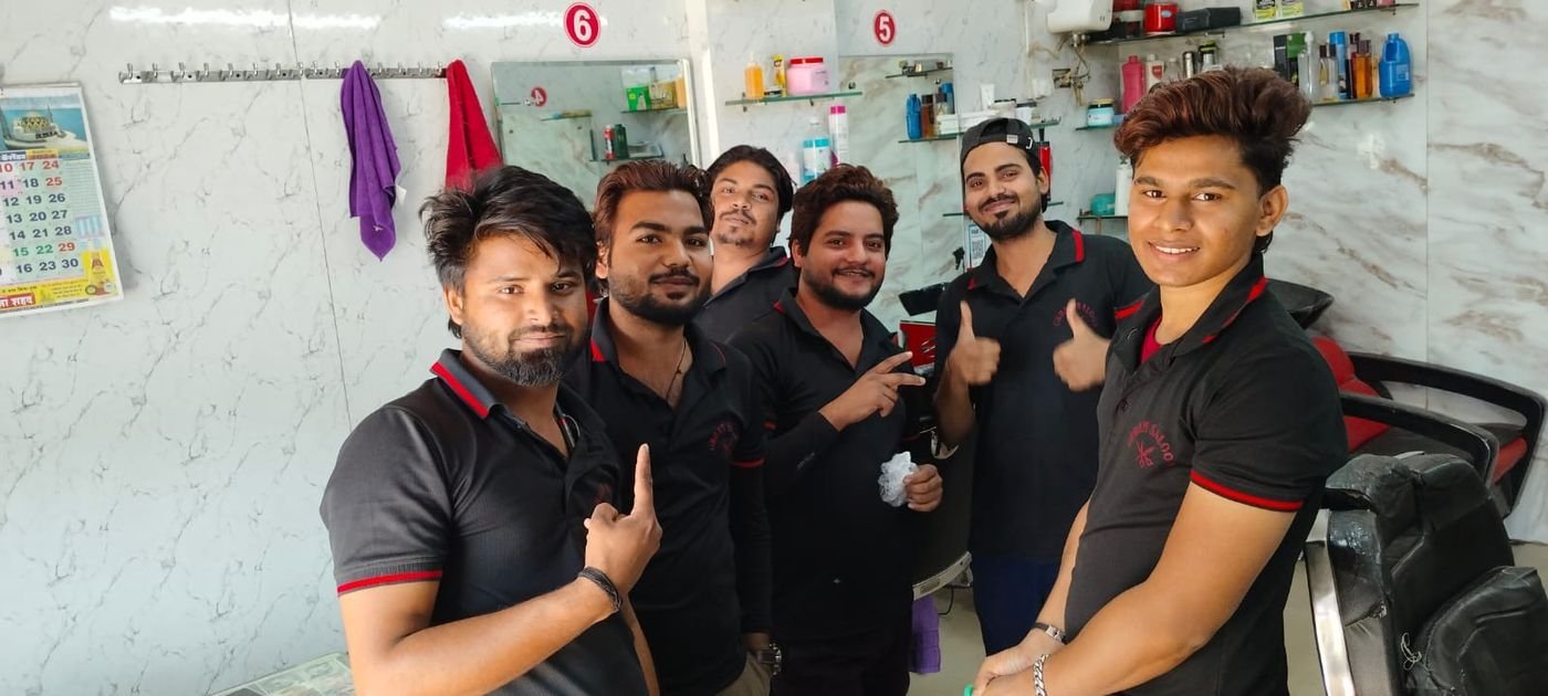 Urban Saloon team giving thumbs up inside the salon